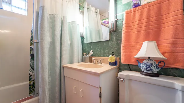 a room with a sink and a mirror