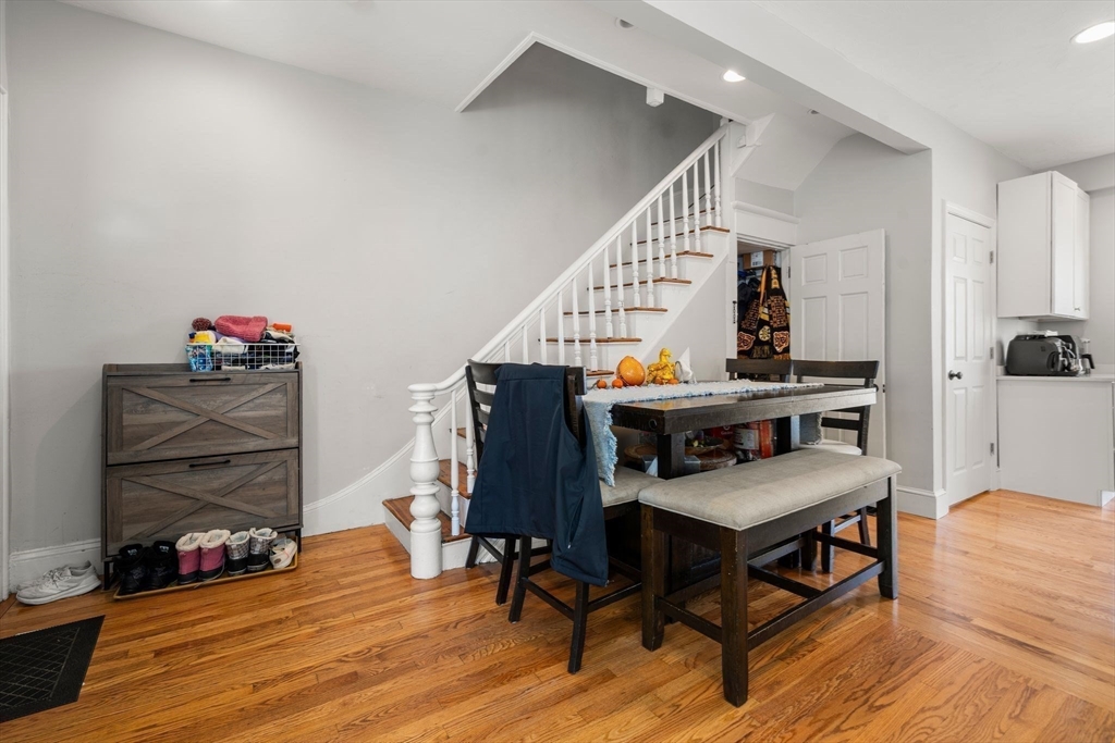 110 D Street Boston, MA 02127 - Photo 11 of 33 a view of a workspace with furniture and wooden floor