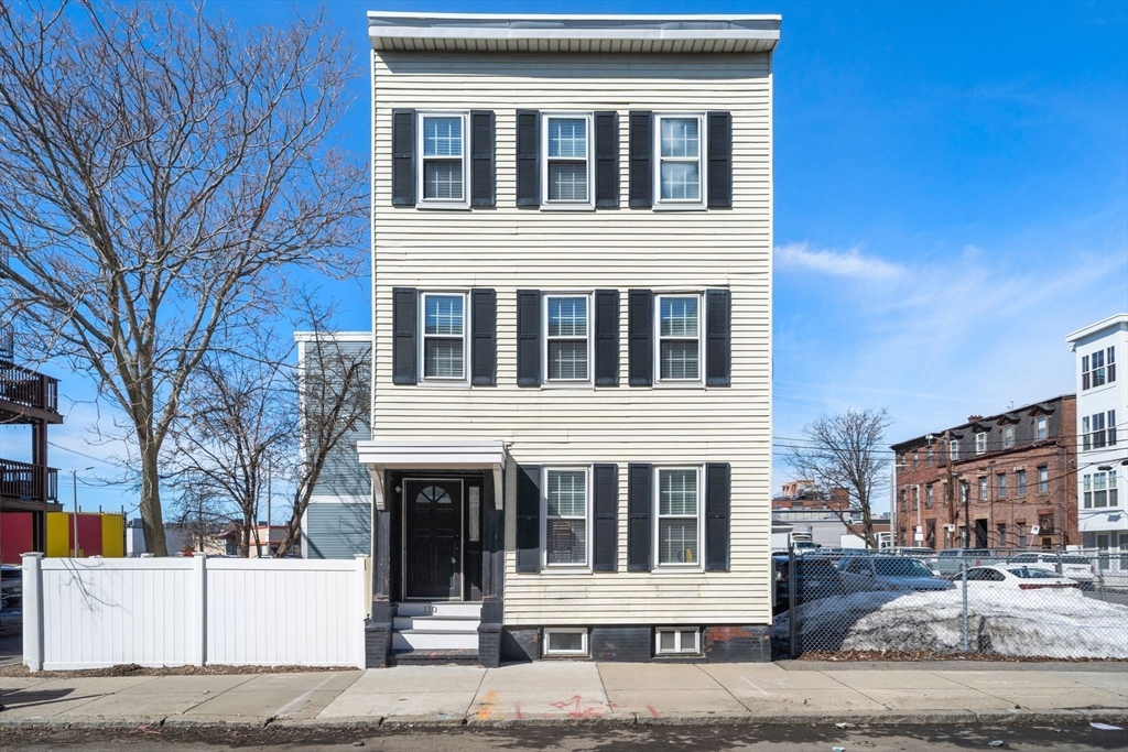 110 D Street Boston, MA 02127 - Photo 2 of 33 a house that has a window in front of it