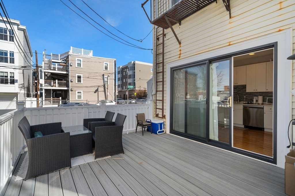 110 D Street Boston, MA 02127 - Photo 25 of 33 a view of a patio with table and chairs