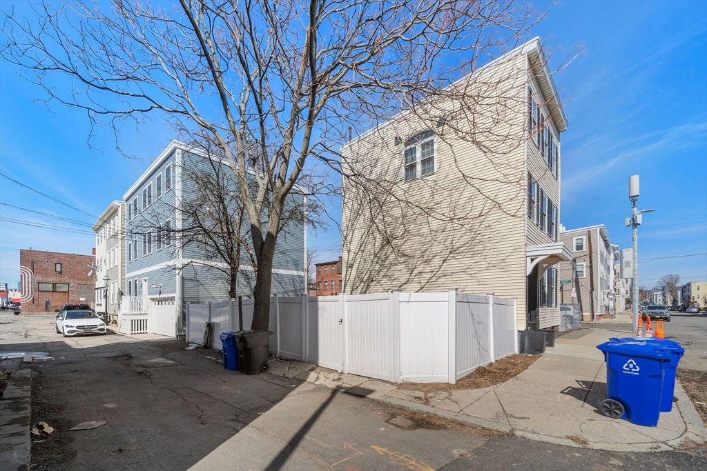 110 D Street Boston, MA 02127 - Photo 26 of 33 a view of a house with a yard