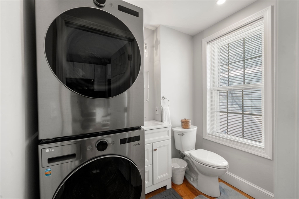 110 D Street Boston, MA 02127 - Photo 5 of 33 a bathroom with a toilet and a sink