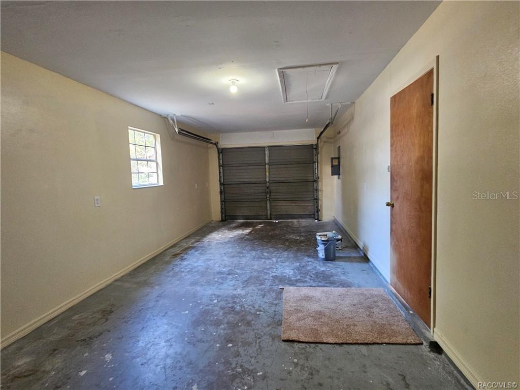 7370 West 7 Rivers Drive Crystal River, FL 34429 - Photo 16 of 22 a view of an empty room with wooden floor and a window