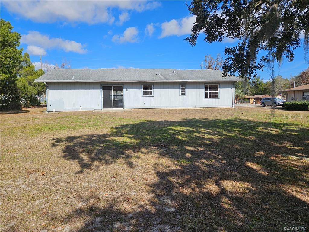 7370 West 7 Rivers Drive Crystal River, FL 34429 - Photo 20 of 22 a front view of a house with a yard