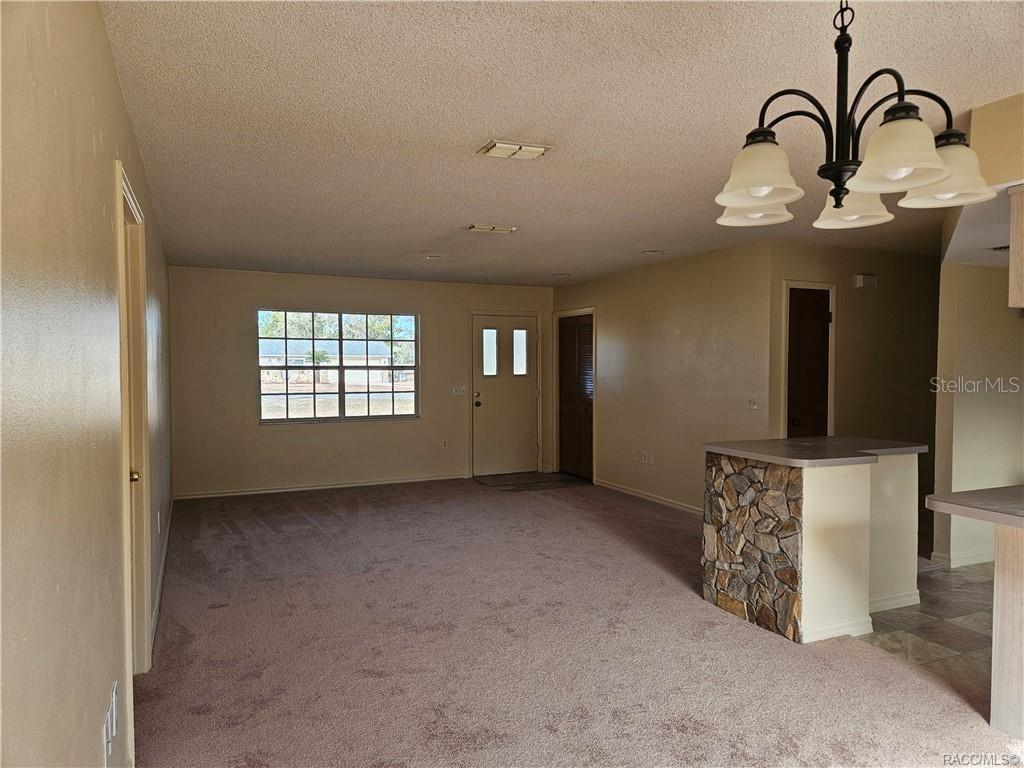 7370 West 7 Rivers Drive Crystal River, FL 34429 - Photo 2 of 22 a view of an empty room with windows
