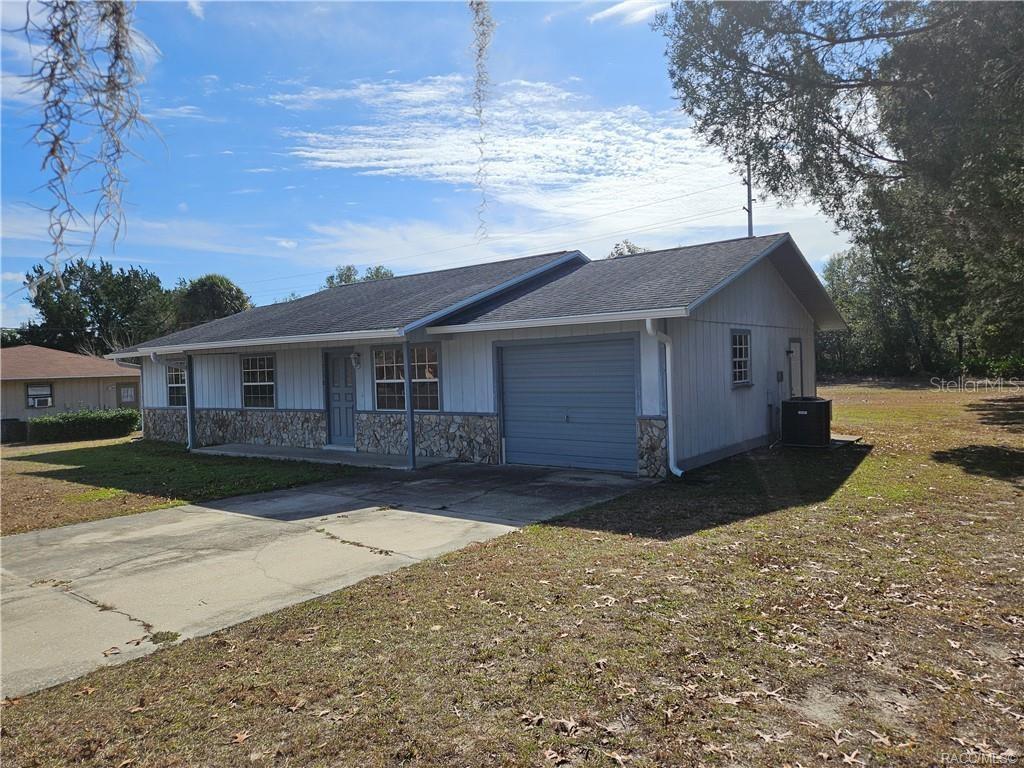 7370 West 7 Rivers Drive Crystal River, FL 34429 - Photo 22 of 22 a view of a yard in front of a house with large tree