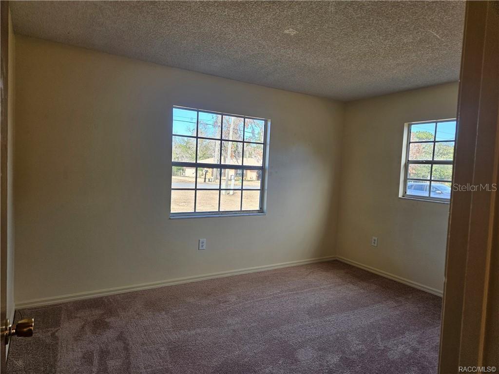 7370 West 7 Rivers Drive Crystal River, FL 34429 - Photo 9 of 22 an empty room with windows