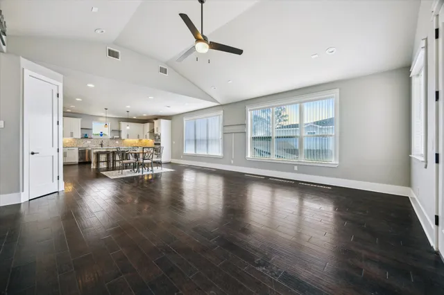 a view of a room with wooden floors