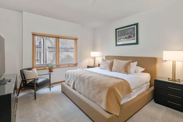 a bedroom with a bed and a couch