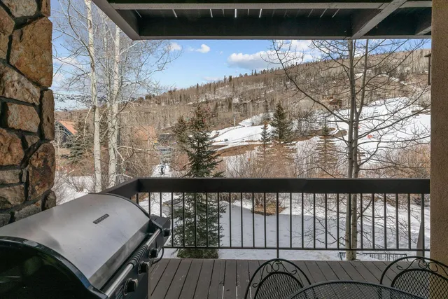 a view of a balcony with furniture