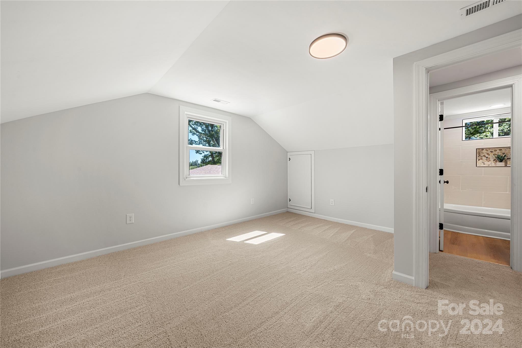 914 Margrace Road Kings Mountain, NC 28086 - Photo 12 of 36 an empty room with windows and entrance to other room