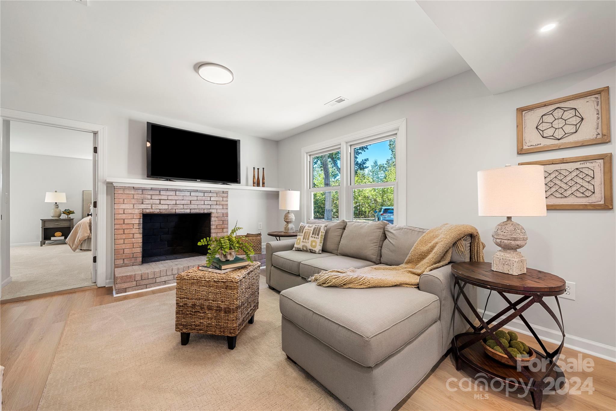 914 Margrace Road Kings Mountain, NC 28086 - Photo 18 of 36 a living room with furniture a flat screen tv and a fireplace