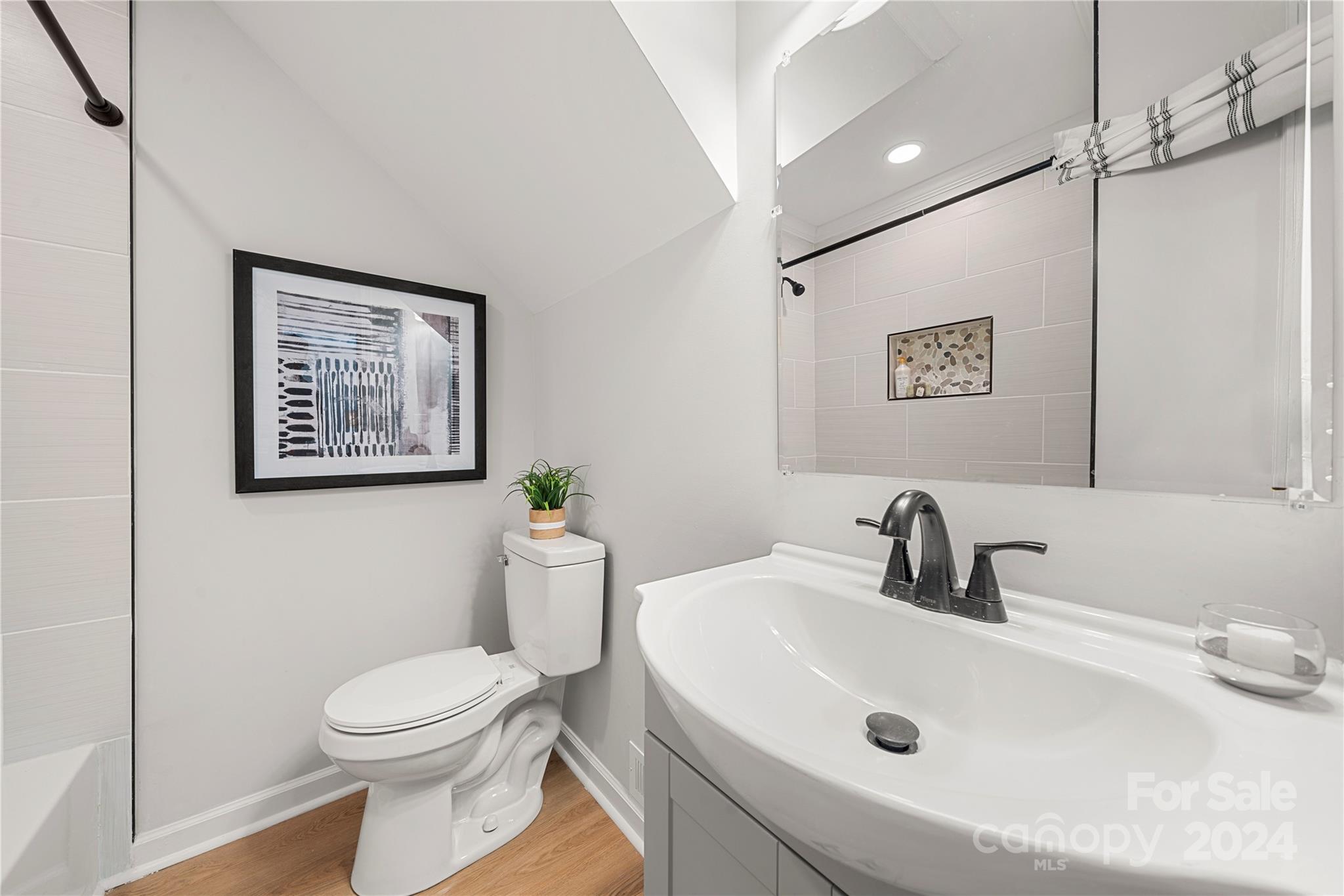 914 Margrace Road Kings Mountain, NC 28086 - Photo 24 of 36 a bathroom with a toilet sink and mirror