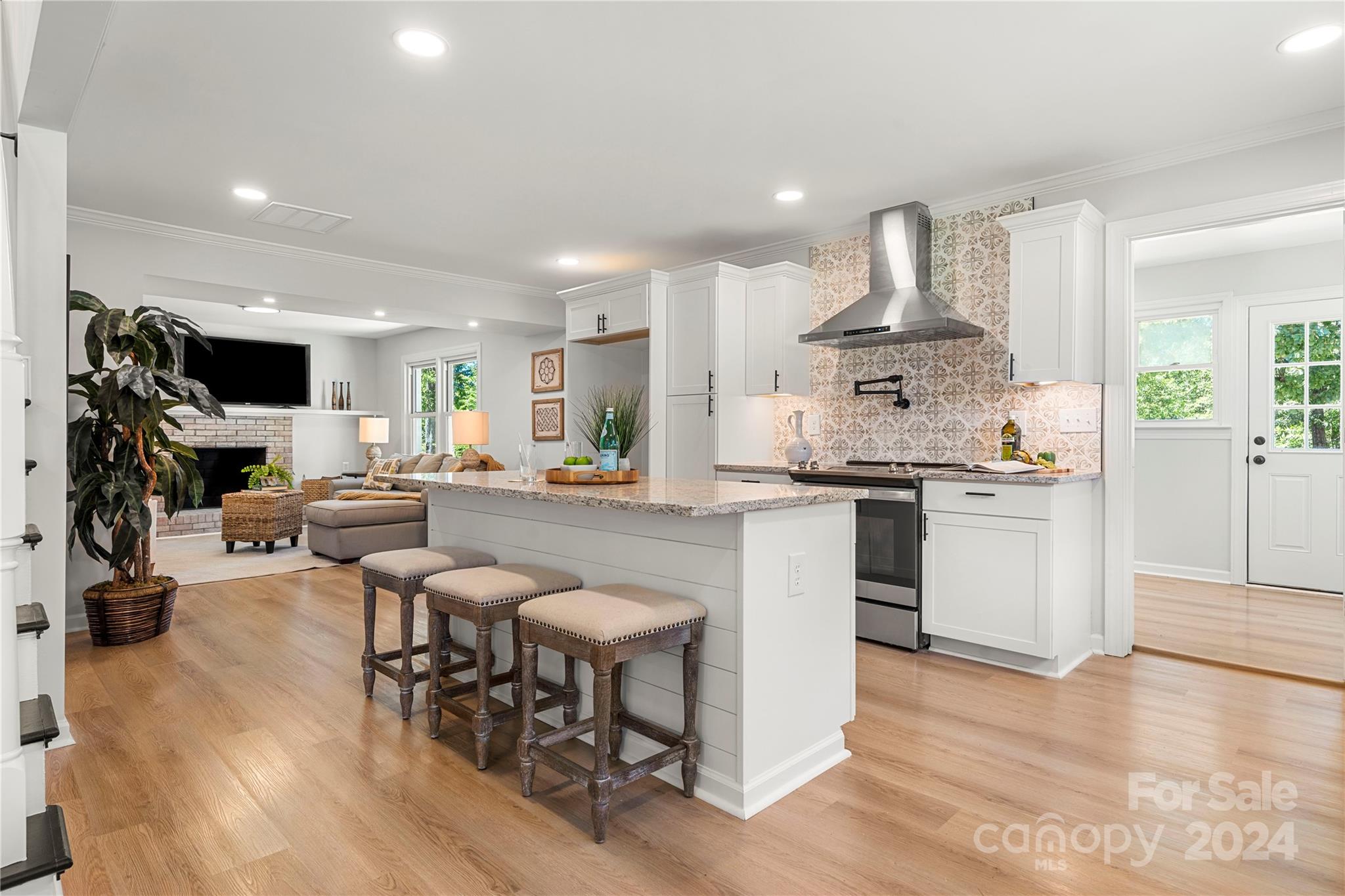 914 Margrace Road Kings Mountain, NC 28086 - Photo 3 of 36 a kitchen with stainless steel appliances a dining table chairs stove and white cabinets