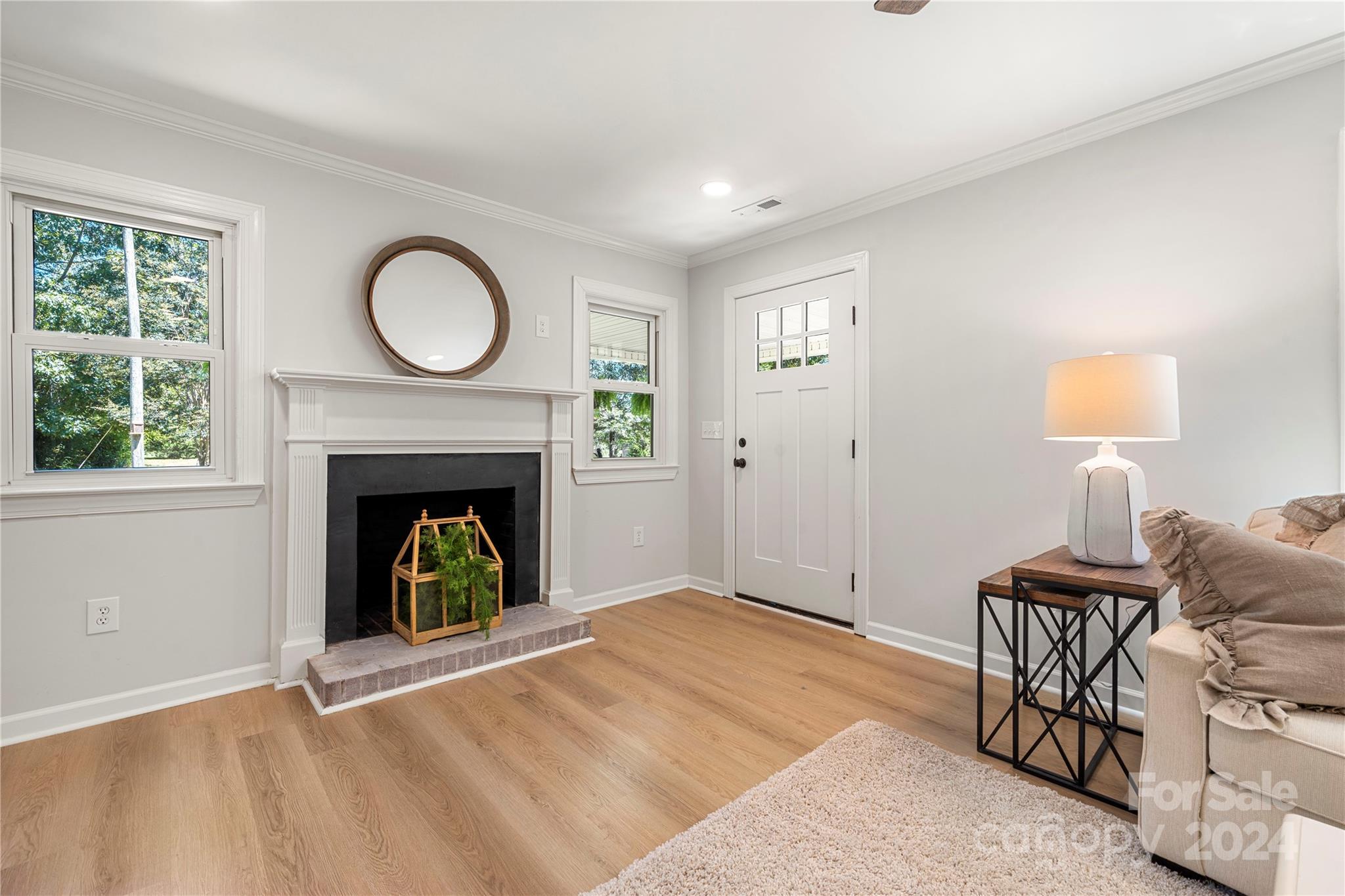 914 Margrace Road Kings Mountain, NC 28086 - Photo 31 of 36 a view of livingroom with furniture a fireplace and wooden floor