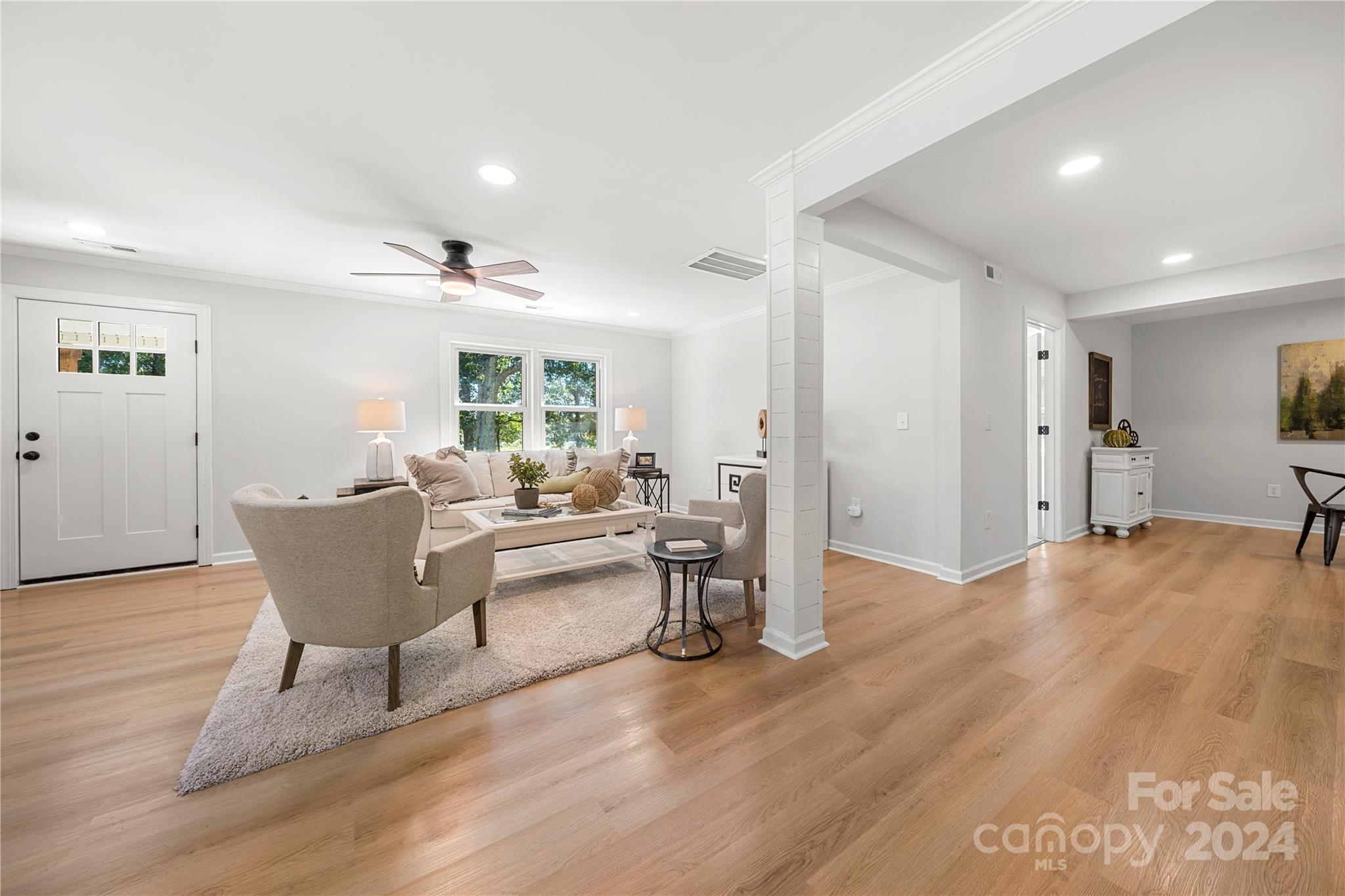 914 Margrace Road Kings Mountain, NC 28086 - Photo 9 of 36 a living room with furniture a large window and wooden floor