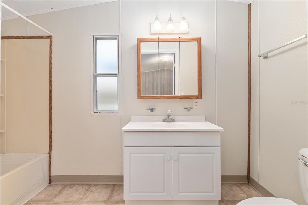 8535 Southwest 155th Street Dunnellon, FL 34432 - Photo 20 of 35 a bathroom with a sink and a mirror