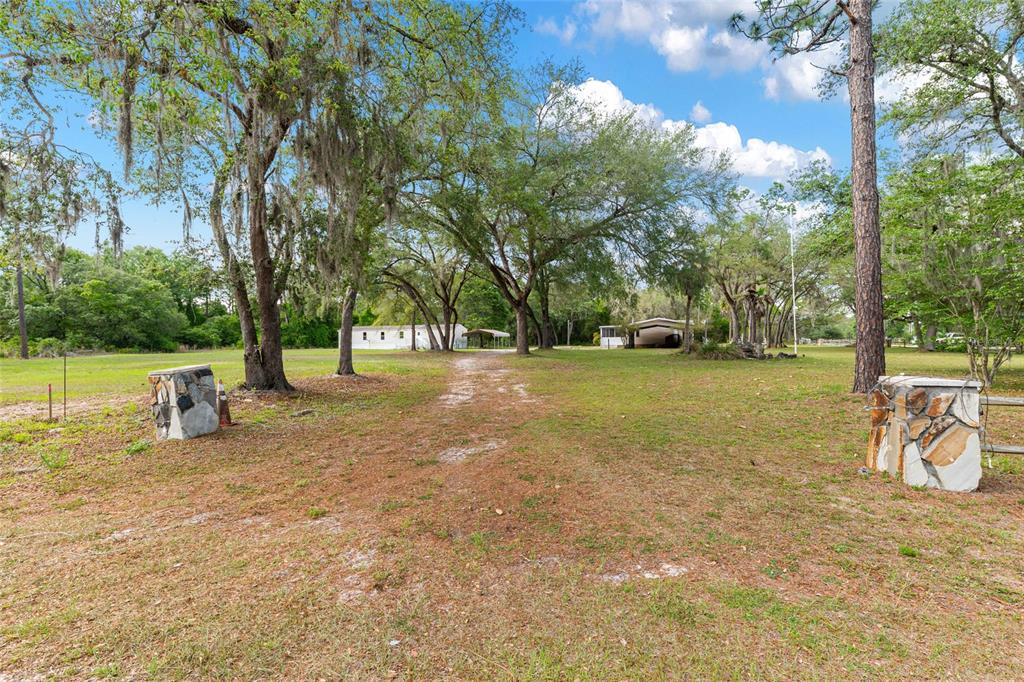 8535 Southwest 155th Street Dunnellon, FL 34432 - Photo 2 of 35 a view of a playground with a slide