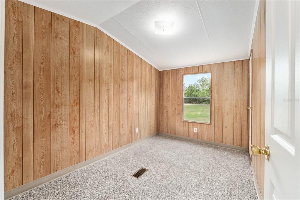 8535 Southwest 155th Street Dunnellon, FL 34432 - Photo 21 of 35 a view of an empty room with a window