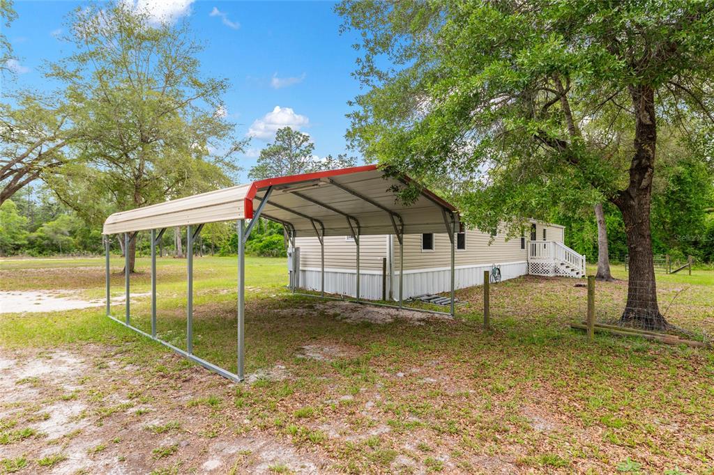 8535 Southwest 155th Street Dunnellon, FL 34432 - Photo 27 of 35 a house view with a backyard space
