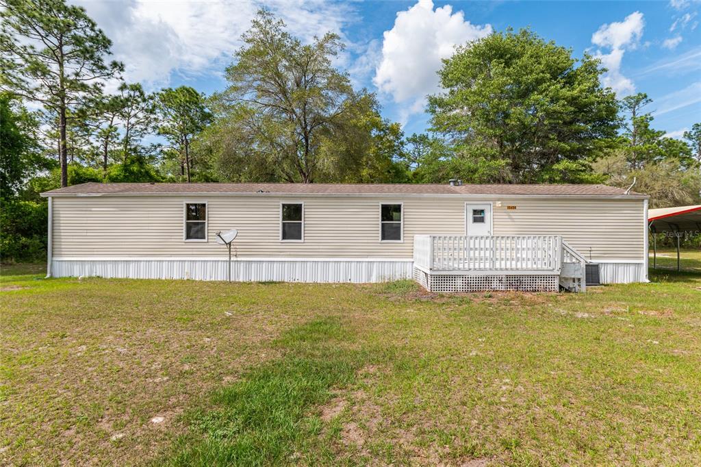 8535 Southwest 155th Street Dunnellon, FL 34432 - Photo 3 of 35 a view of a house with a backyard and lake view