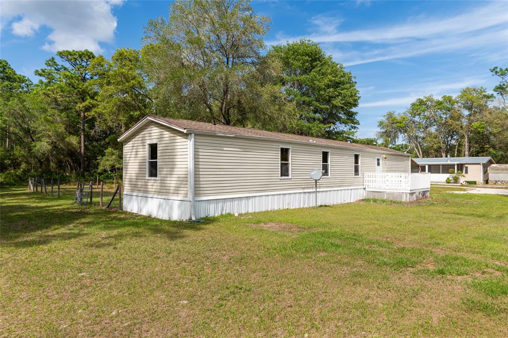 8535 Southwest 155th Street Dunnellon, FL 34432 - Photo 35 of 35 a view of a house with a yard