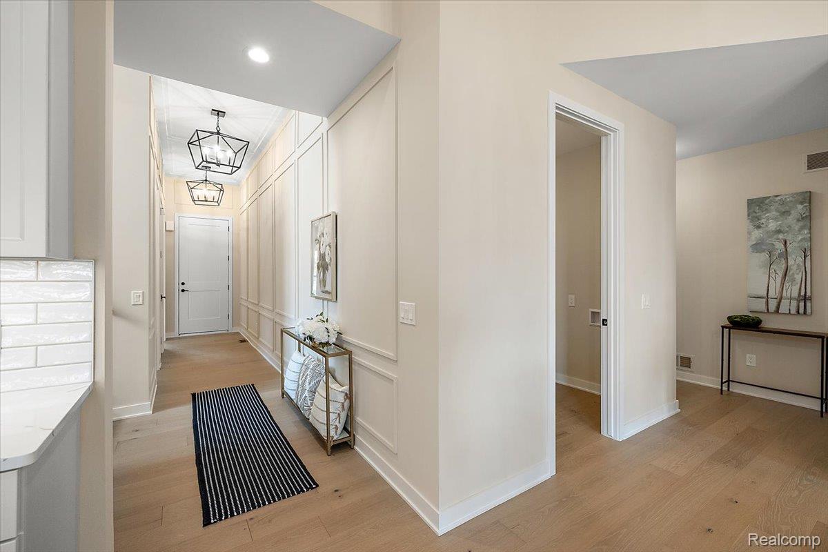 2032 Breckenridge Court, Unit 9 Rochester, MI 48309 - Photo 10 of 39 Hallway with light wood-style flooring