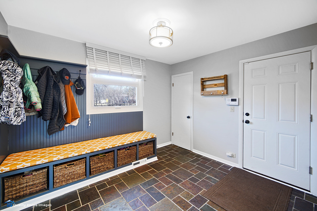 2007 Driving Park Road Wheaton, IL 60187 - Photo 13 of 29 a hallway with a large mirror and a window