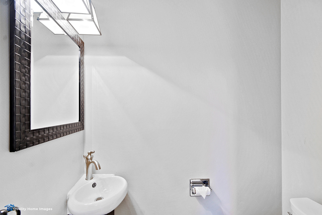 2007 Driving Park Road Wheaton, IL 60187 - Photo 14 of 29 a bathroom with a sink and a mirror