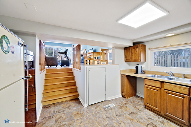 2007 Driving Park Road Wheaton, IL 60187 - Photo 23 of 29 a view of a kitchen with fridge and workspace