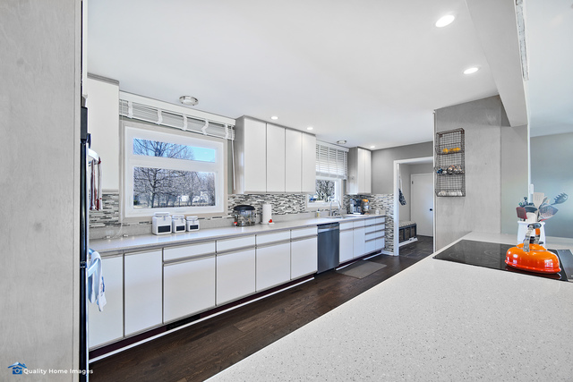 2007 Driving Park Road Wheaton, IL 60187 - Photo 8 of 29 a large white kitchen with a lot of counter space and wooden floor