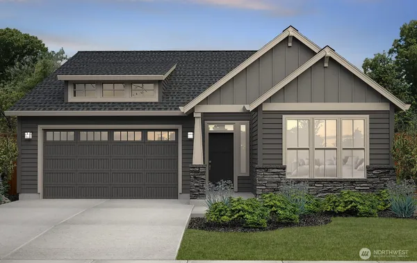 a front view of a house with a garage