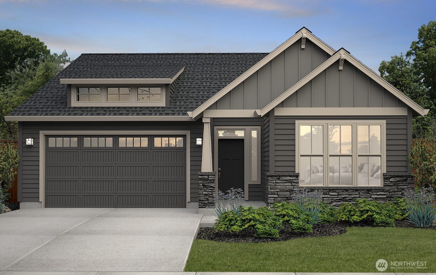 609 Powell Avenue Winlock, WA 98596 - Photo 1 of 3 a front view of a house with a garage