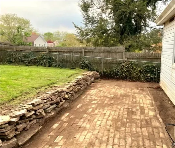 a view of a yard with an outdoor space