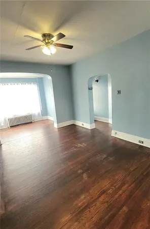 a view of a livingroom with wooden floor