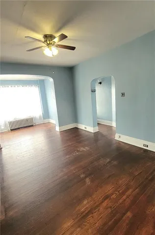 a view of a livingroom with wooden floor