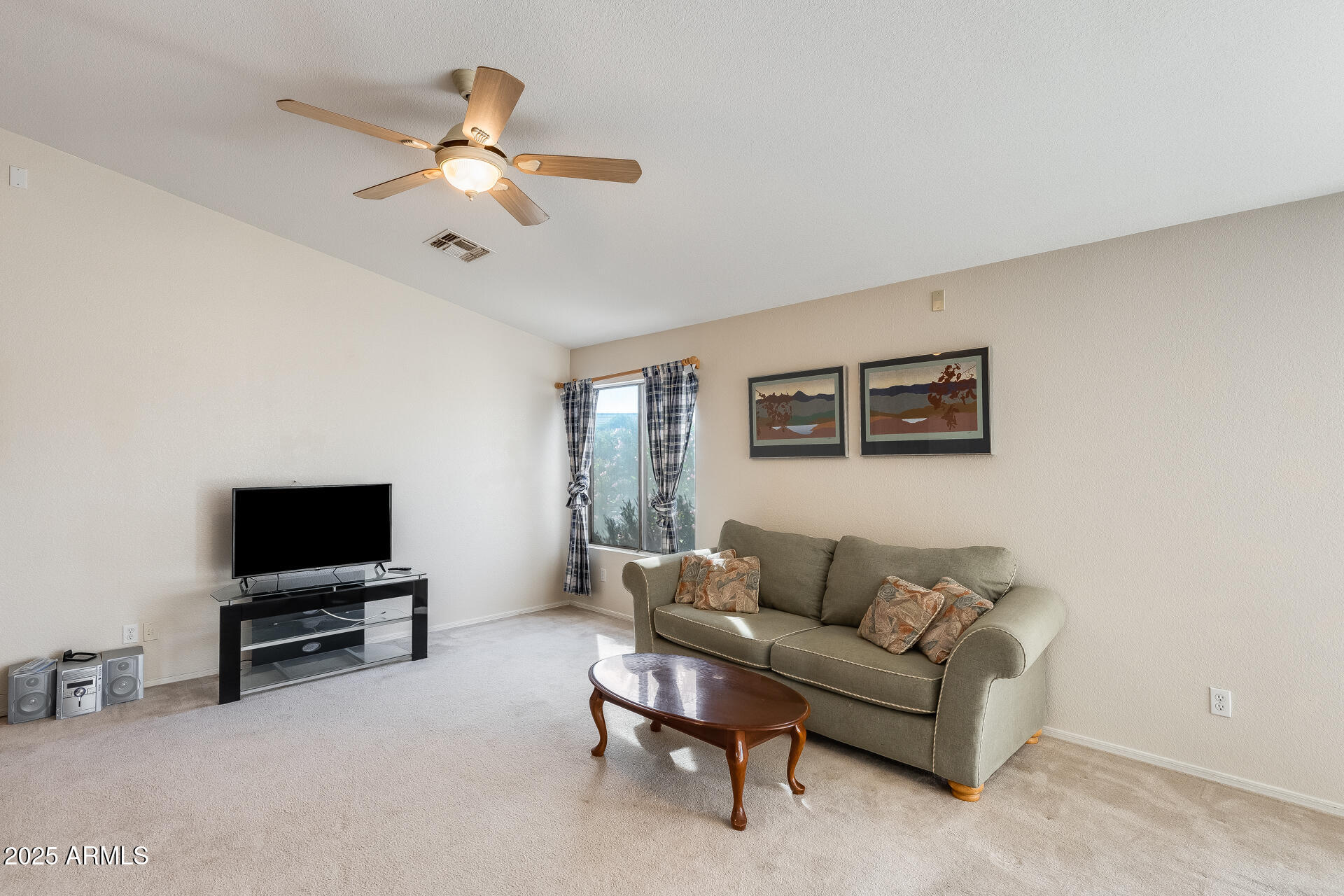 642 South Thunderbird Drive Apache Junction, AZ 85120 - Photo 10 of 53 a living room with furniture and a flat screen tv