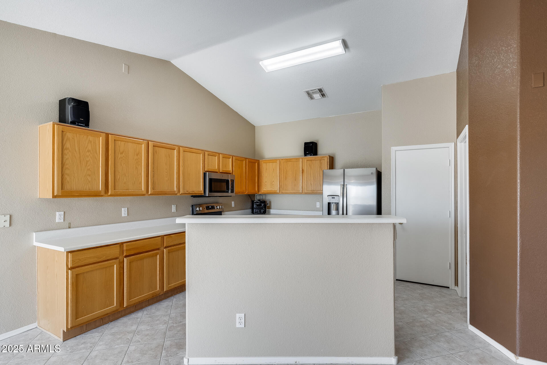 642 South Thunderbird Drive Apache Junction, AZ 85120 - Photo 12 of 53 a kitchen with a sink a stove and a refrigerator