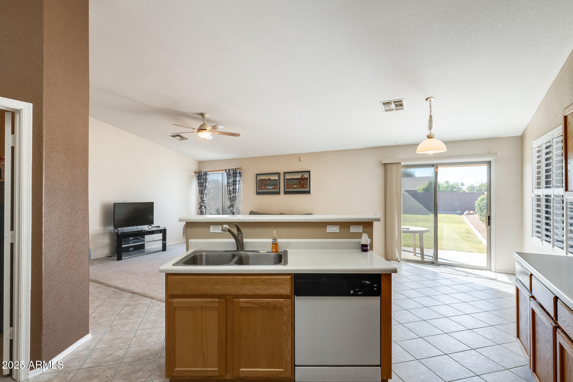 642 South Thunderbird Drive Apache Junction, AZ 85120 - Photo 16 of 53 a kitchen with a sink stove and refrigerator