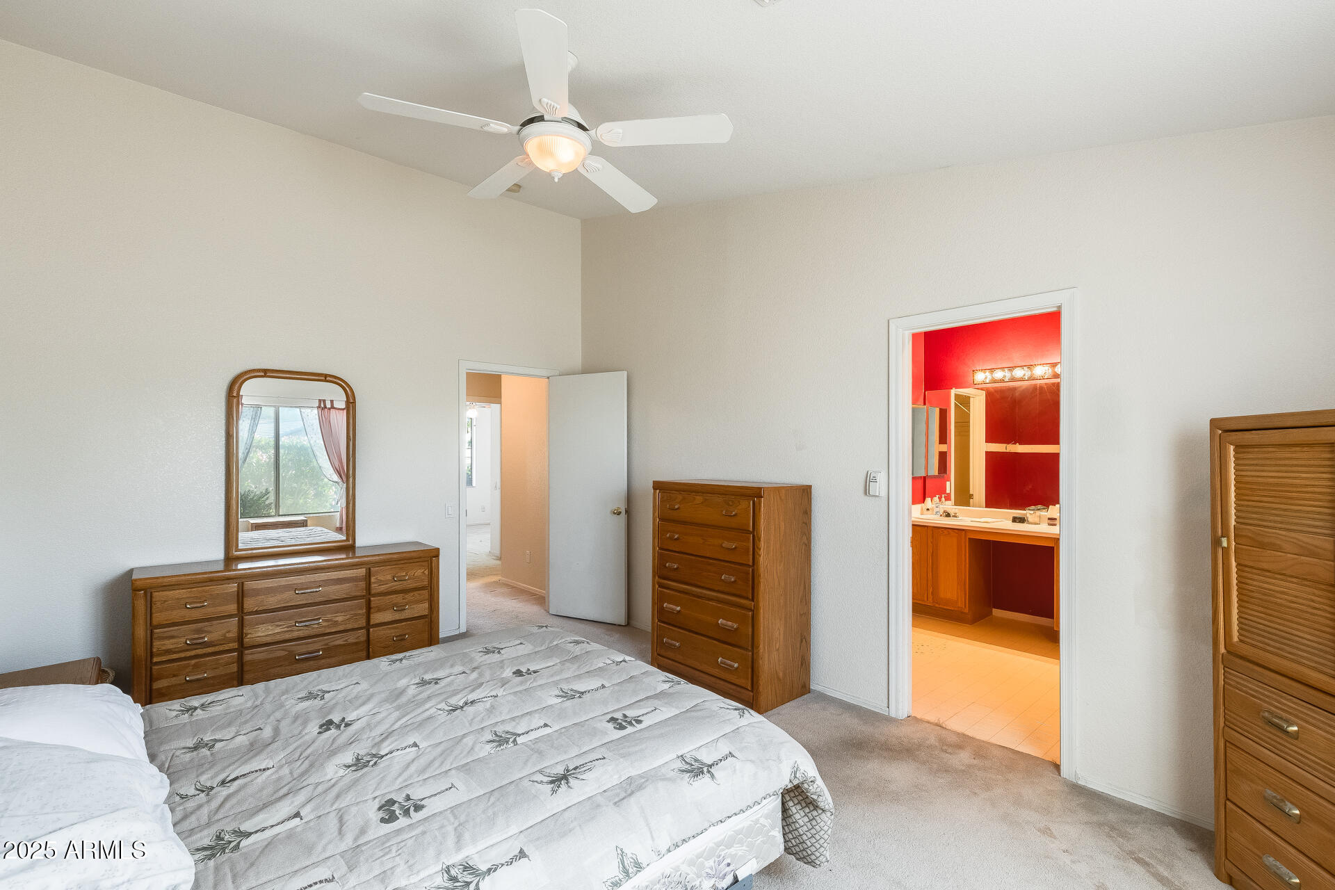 642 South Thunderbird Drive Apache Junction, AZ 85120 - Photo 22 of 53 a bedroom with a bed and a dresser