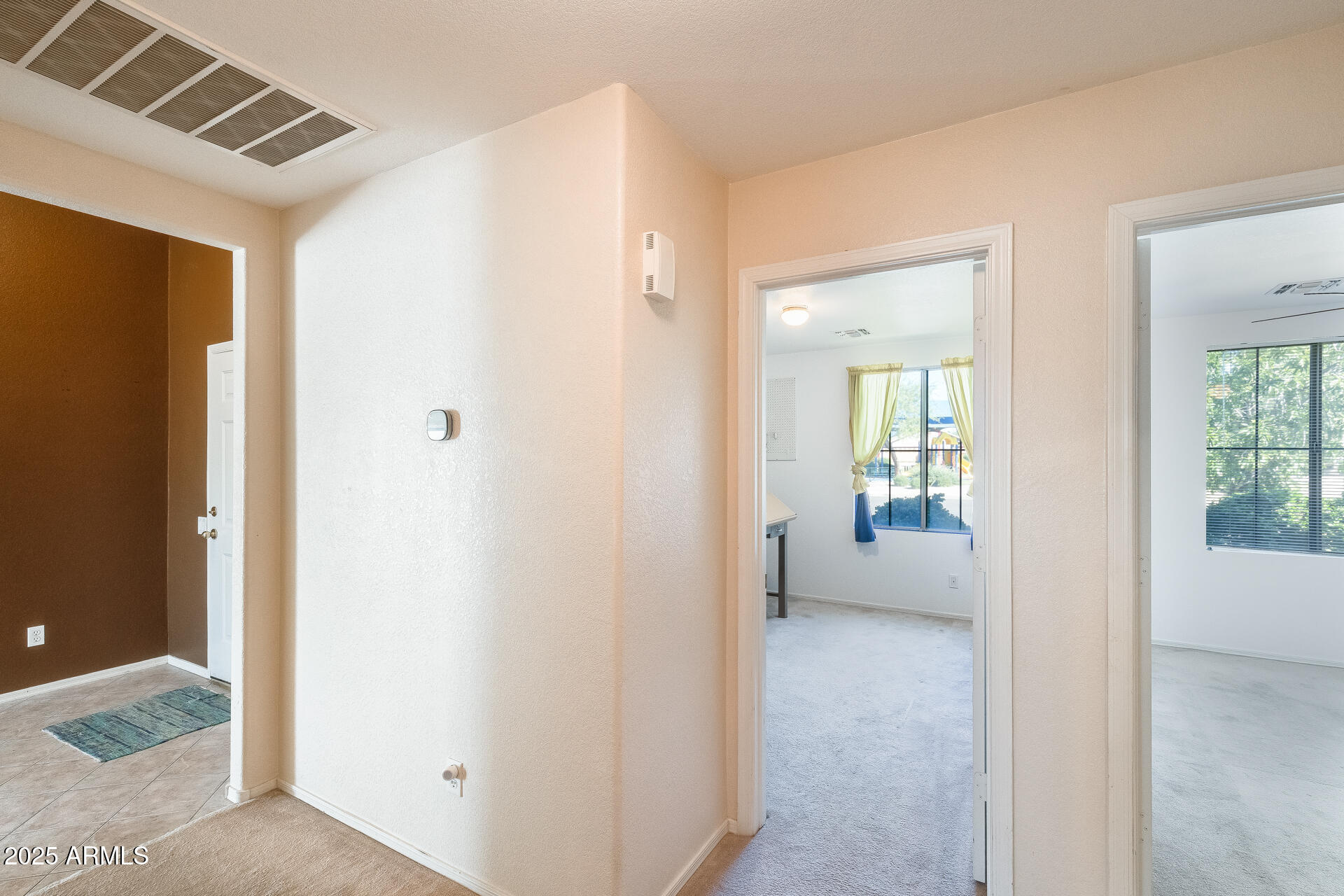 642 South Thunderbird Drive Apache Junction, AZ 85120 - Photo 27 of 53 a view of a livingroom with wooden floor and windows