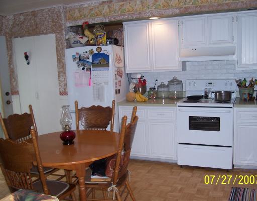 147 Community Center Road Harmony, PA 16037 - Photo 3 of 8 Kitchen. Kitchen with sliding glass/screen door to side deck.