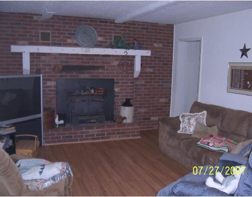 147 Community Center Road Harmony, PA 16037 - Photo 4 of 8 Living Room. Wood burning fireplace.