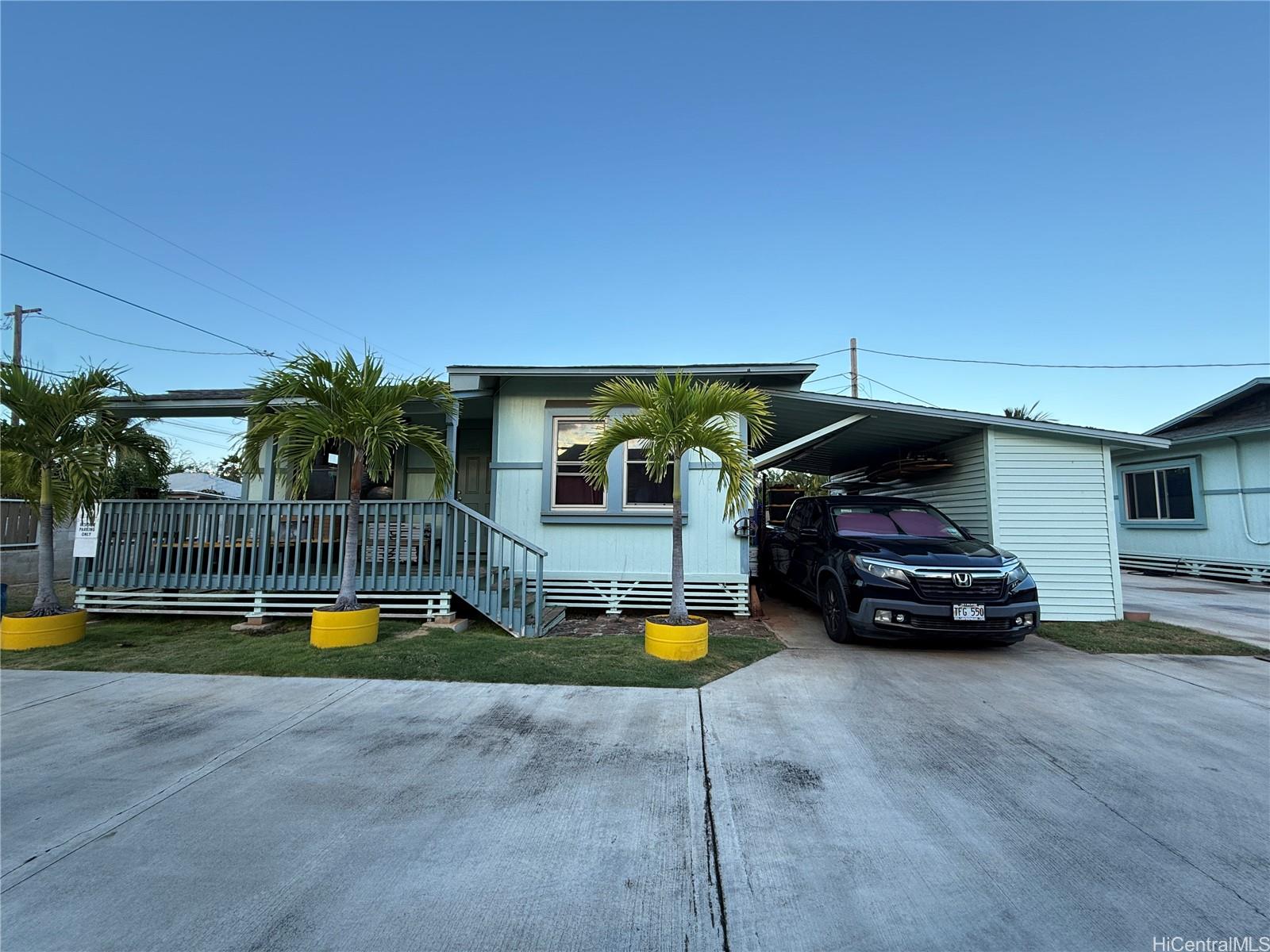 91-249 Ewa Beach Road Ewa Beach, HI 96706 - Photo 16 of 24 a car parked in front of a house