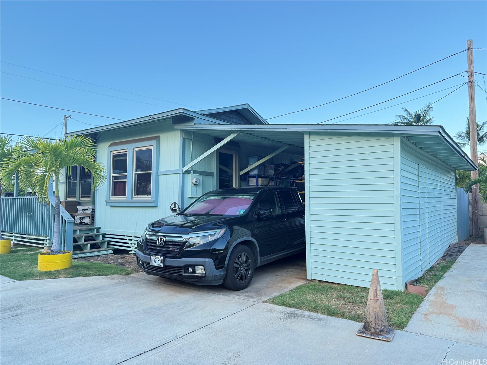 91-249 Ewa Beach Road Ewa Beach, HI 96706 - Photo 17 of 24 a car parked in front of house