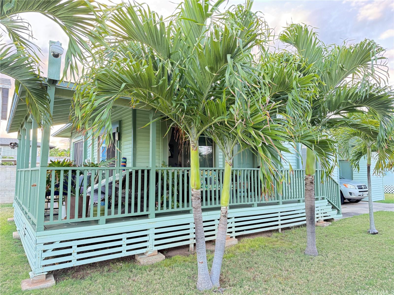 91-249 Ewa Beach Road Ewa Beach, HI 96706 - Photo 22 of 24 a view of a bench in a backyard