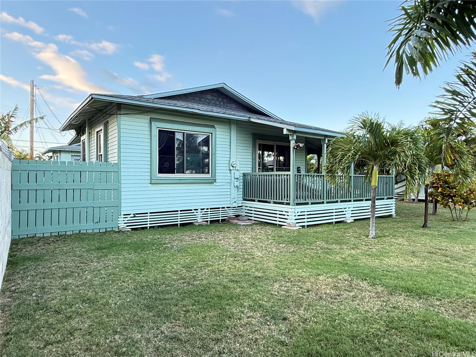 91-249 Ewa Beach Road Ewa Beach, HI 96706 - Photo 3 of 24 a view of a house with a backyard