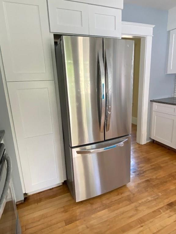 64 Chilson Street Springfield, MA 01118 - Photo 13 of 36 a metallic refrigerator freezer sitting in a kitchen
