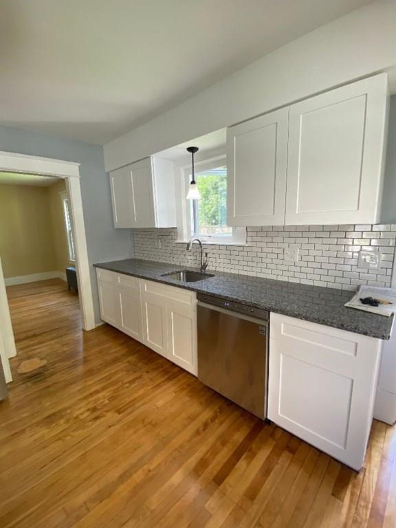 64 Chilson Street Springfield, MA 01118 - Photo 14 of 36 a kitchen with granite countertop a sink and cabinets
