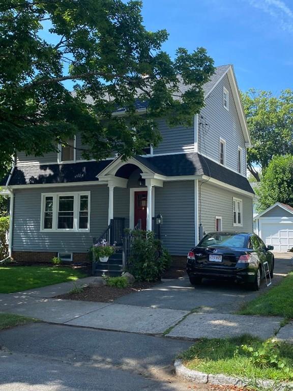 64 Chilson Street Springfield, MA 01118 - Photo 2 of 36 a front view of a house with a garden